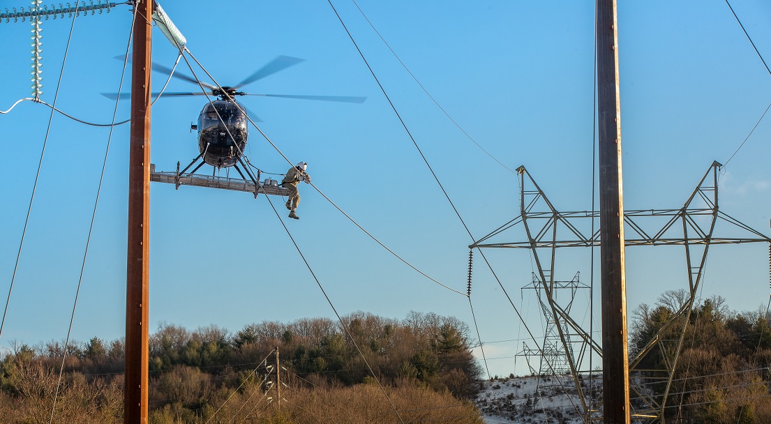 Man using innovative technology to inspect transmission lines