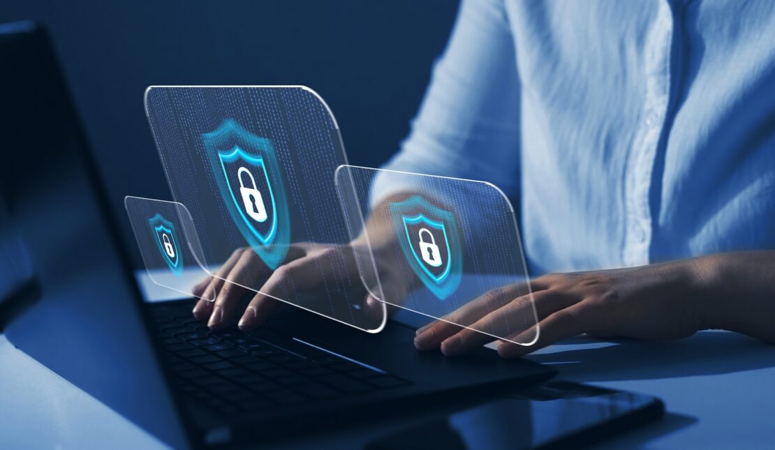 Cyber security lock symbol above laptop