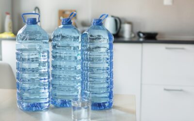 three bottles of water on the counter