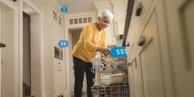 Older woman empties dishwasher