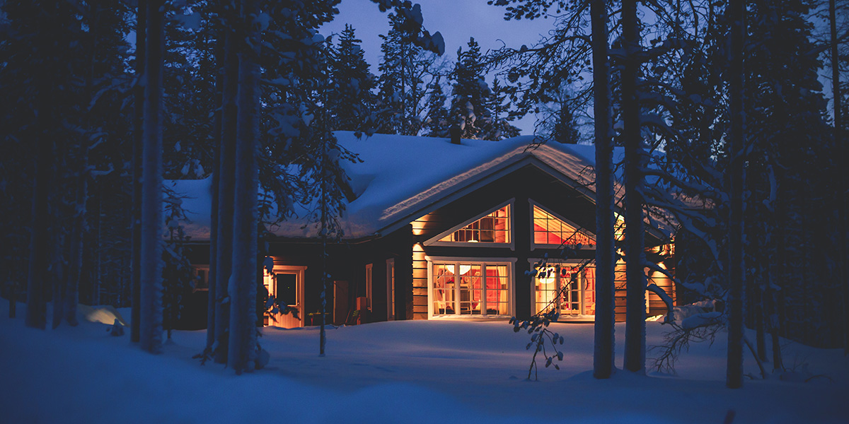 Cozy cabin covered in snow