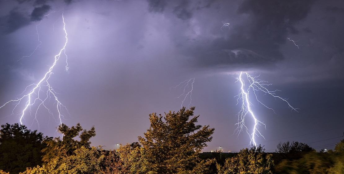 Real flashes of lightning during a thunderstorm, purple sky