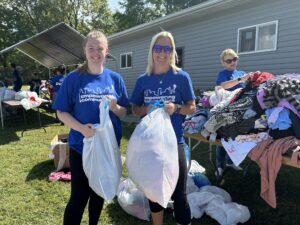 PPL employees holding bags of clothing at the Kindness Project in Emmaus.