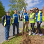 Employee volunteers planting trees