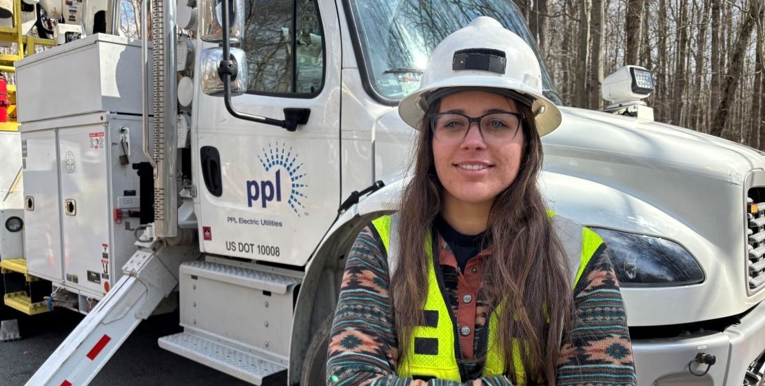 A Photo of Katy Snyder posed in front of a PPL Electric Utilities truck.