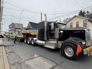 A photo of a transformer being delivered through downtown Dickson City.